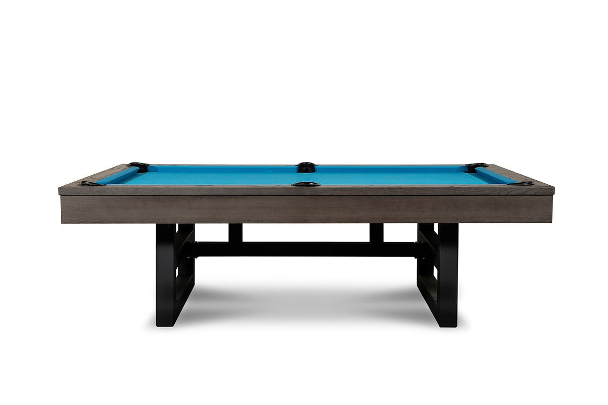 Isabella Chino pool table with slate slate top, charcoal gray wood frame, black metal legs, and bright blue billiard cloth.