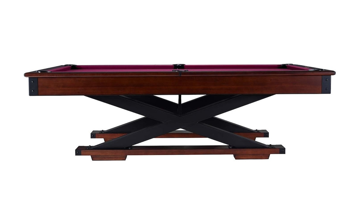 A side view of the Quest pool table with a Navajo finish designed by American Heritage with a magenta felt cloth.