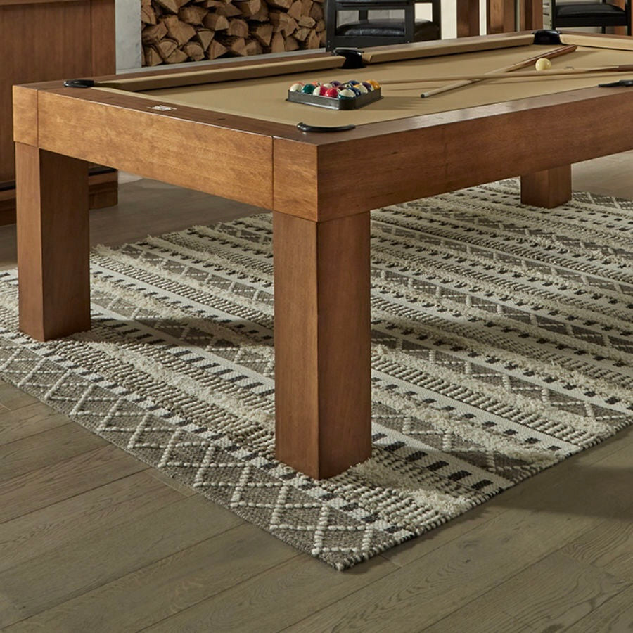 The American Heritage  Alta billiard table in a Brushed Walnut finish and khaki felt is the centerpiece of this game room.