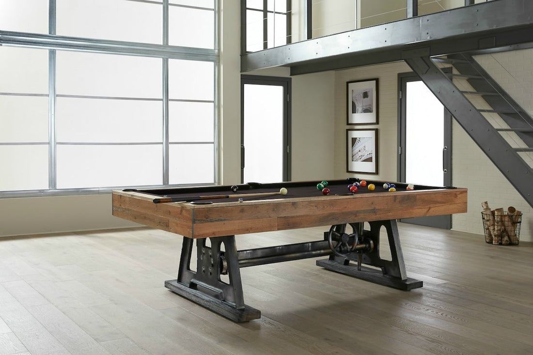 The American Heritage Da Vinci slate pool table with a Reclaimed Brown finish in a game room.