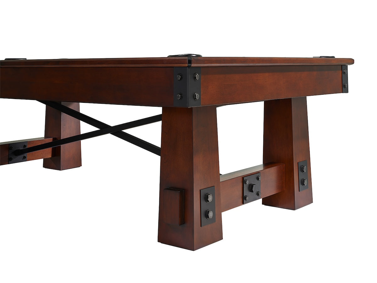 Close-up on the table legs of the Fresco slate pool table by American Heritage with a Navajo wood finish.