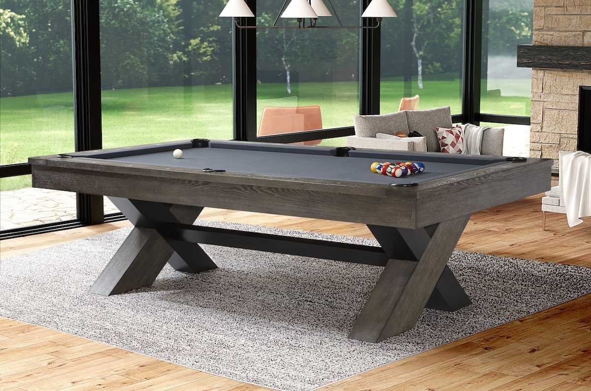 Angled view of the American Heritage Halifax billiard table with billiards balls and cue.