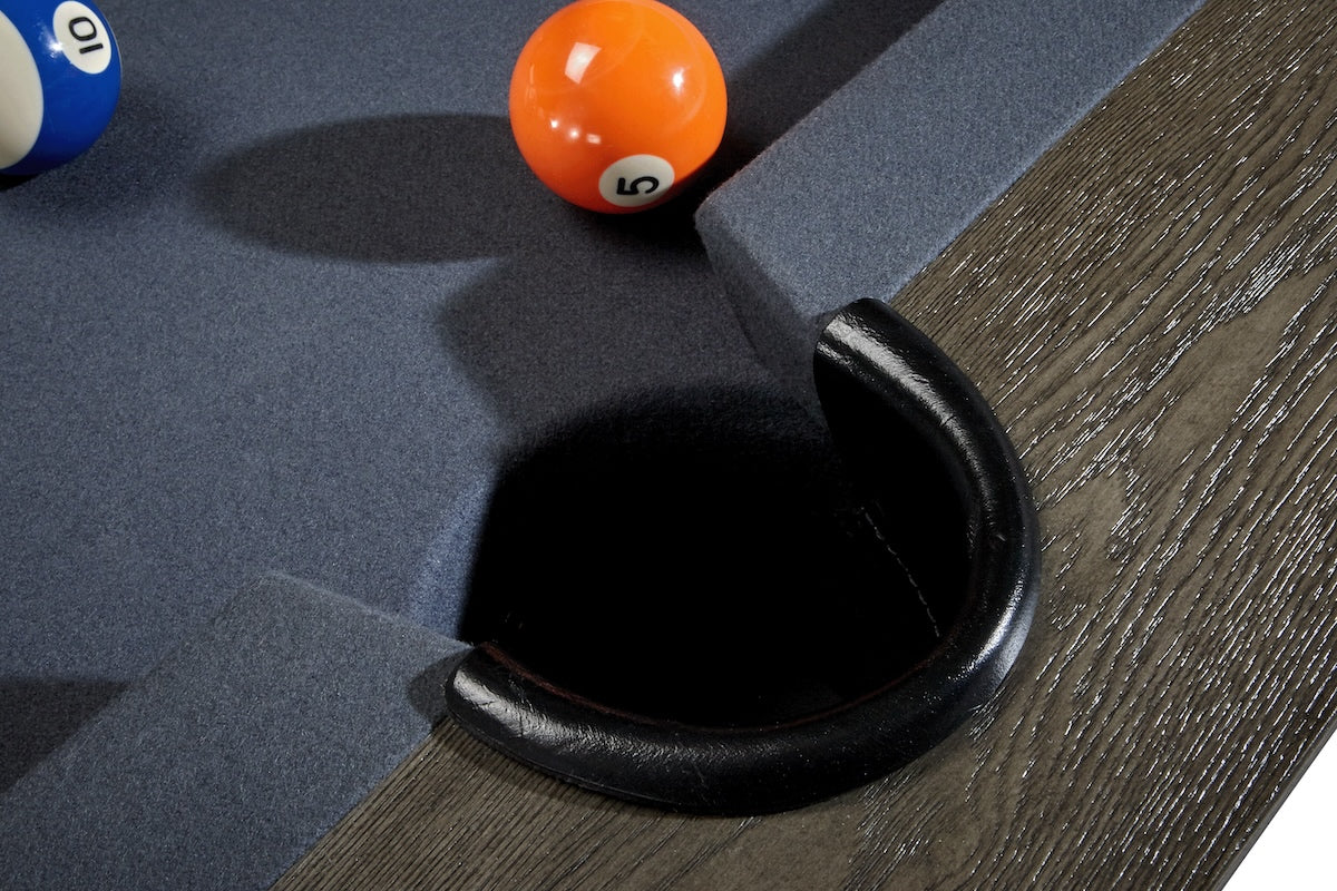 A close-up of a side drop pocket on the American Heritage  Halifax slate pool table.
