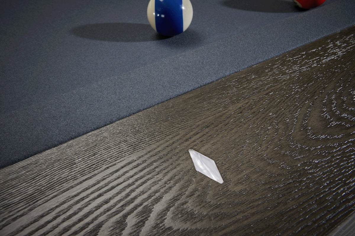 A close-up on one of the diamond-shaped sights on the Halifax pool table by American Heritage.