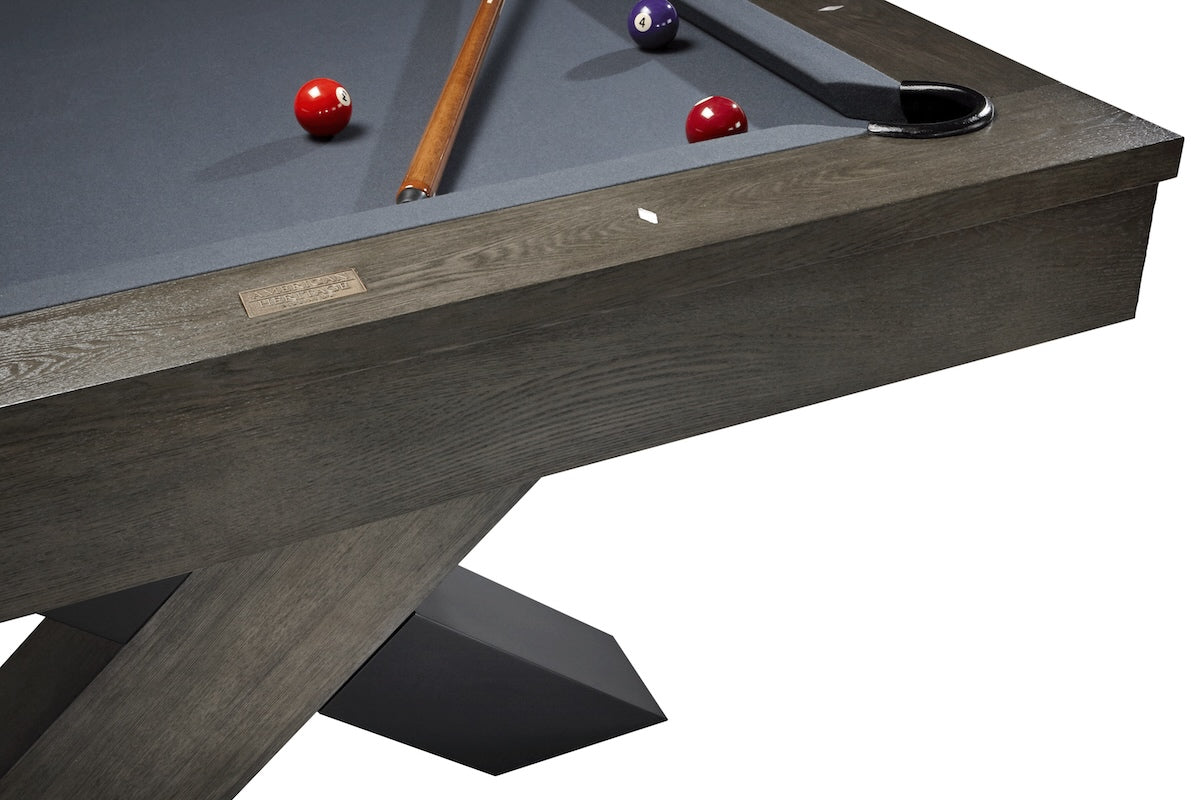 A close-up on a corner of an Halifax slate pool table by American Heritage in a Charcoal wood finish.