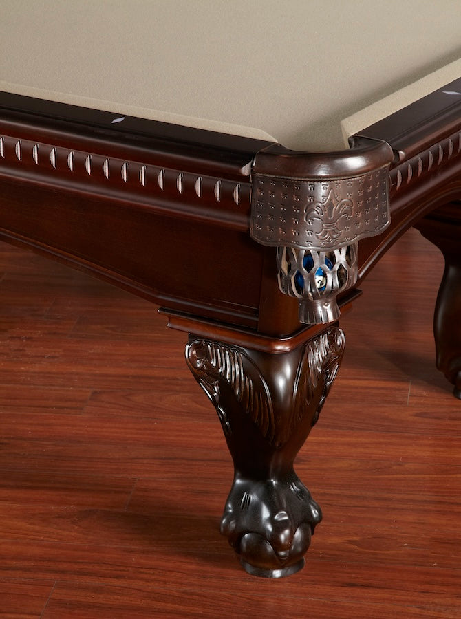 Close-up of a table leg and leather corner pocket of the Marietta slate pool table by American Heritage.