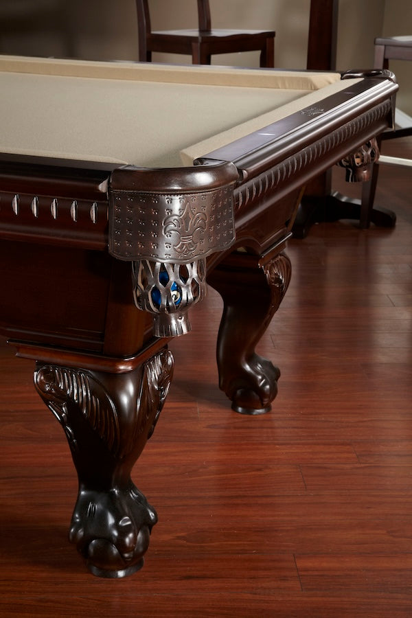 Close-up of ornate carved wood of the Marietta slate pool table by American Heritage.