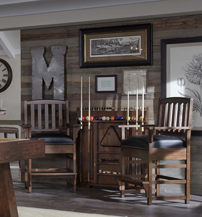 Spectator chairs and pool cue rack designed by American Heritage complete a game room with the Savannah billiard table.