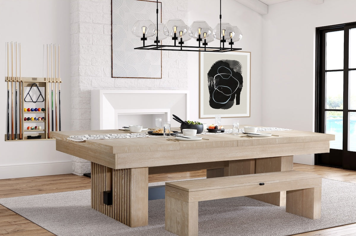 Angled view of the American Heritage Vancouver pool table in Natural Ash with a dining top set with food.