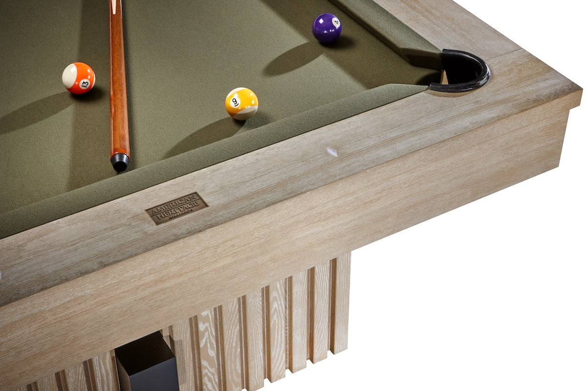 Corner view of the Vancouver slate pool table by designed by American Heritage in green felt and a Natural Ash finish.