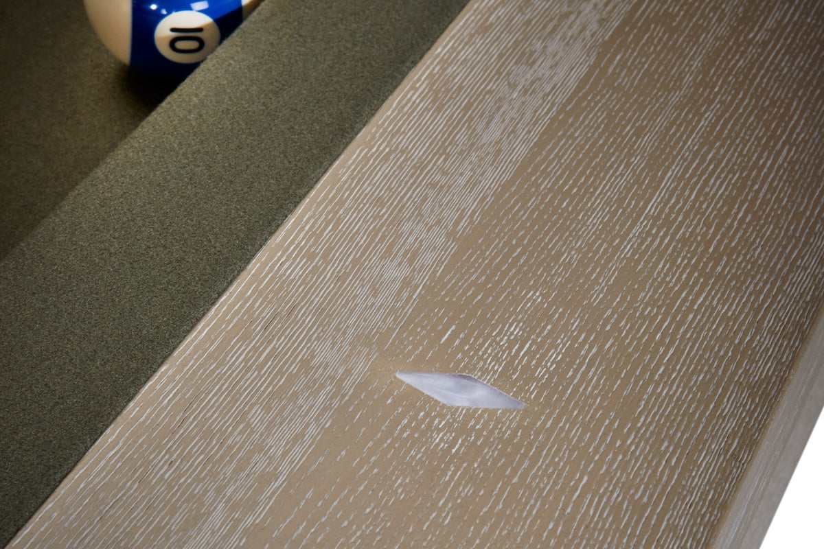 A daimond-shaped sight on an American Heritage Vancouver billiard table in a Natural Ash finish.