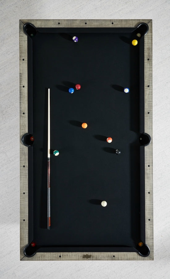 Top view of a Victory slate pool table in an Ocean finish with black felt.
