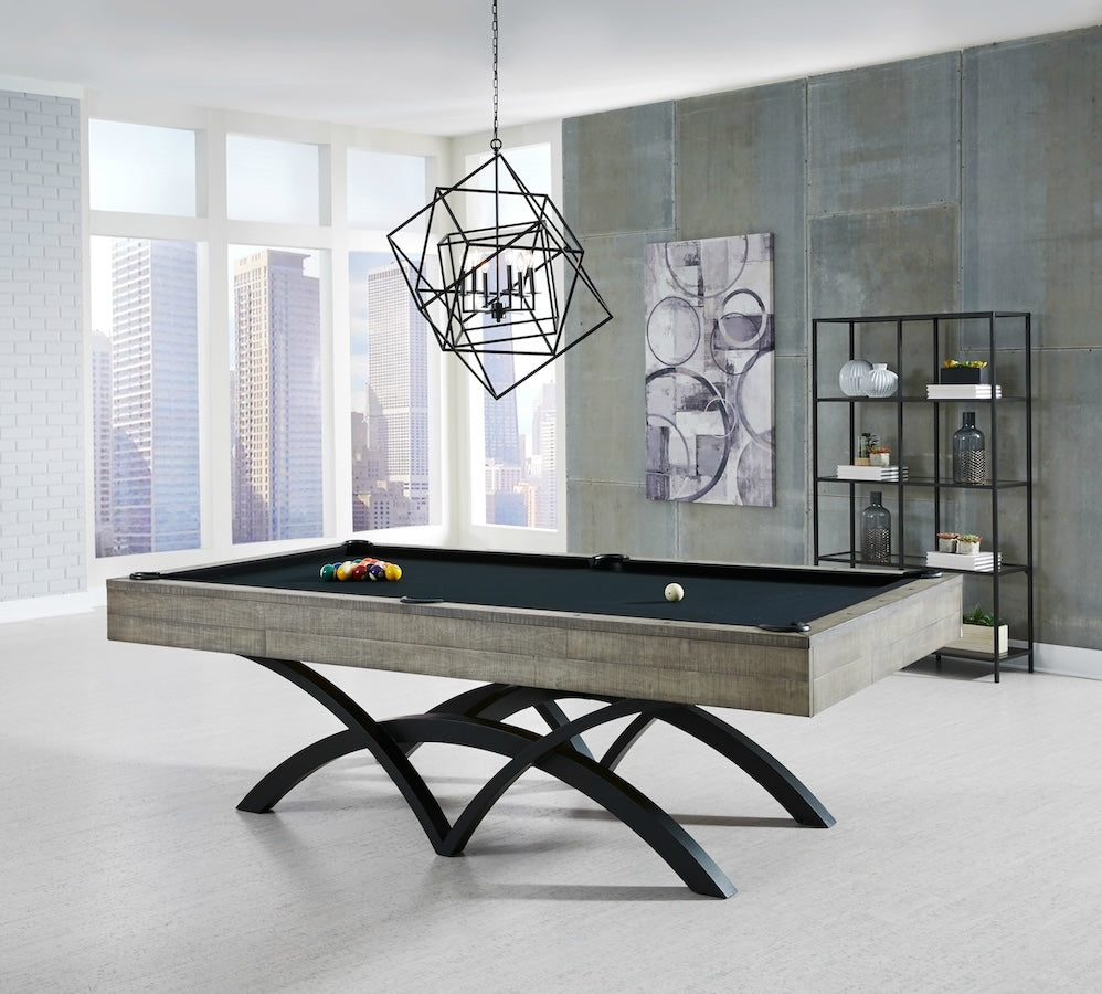 A game room with a Victory slate pool table in an Ocean finish by American Heritage.