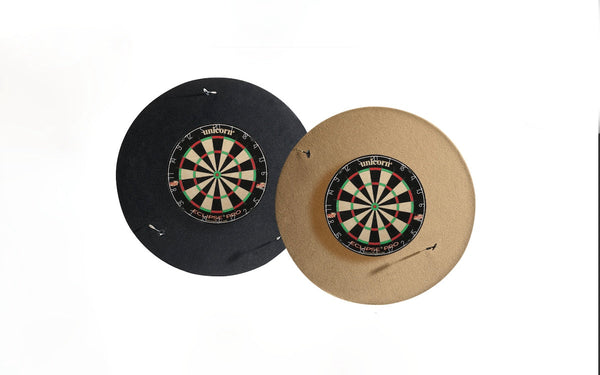 Two American Heritage dart backboards, one tan colored, one black.