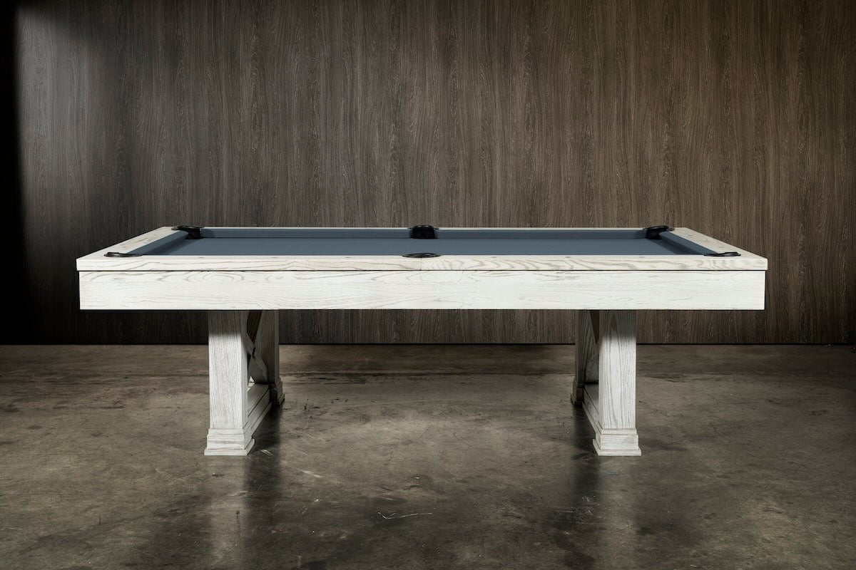 Agriturismo pool table from the side in a dark moody game room.