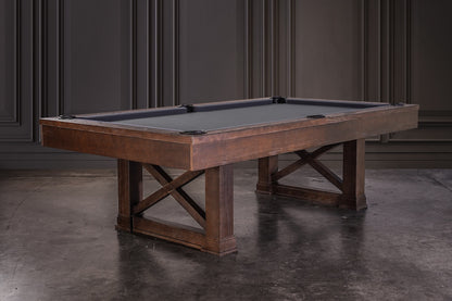 Agriturismo pool table with Brownwash finish stands in a moody game room.