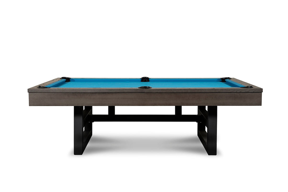 Isabella Chino pool table with slate slate top, charcoal gray wood frame, black metal legs, and bright blue billiard cloth.