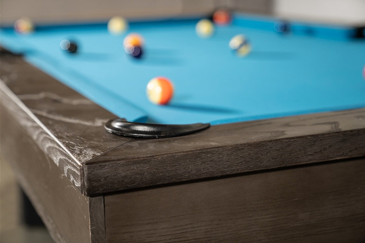 Leather-lined corner pocket of Chino slate pool table.