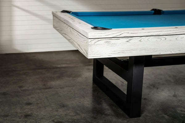 View of one side of a Chino pool table with a whitewash finish.