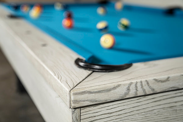 Leather corner drop pocket of Chino slate pool table in whitewash.