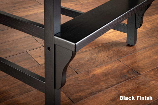 Closeup on footrest of the King chair in Black wood finish designed by American Heritage.