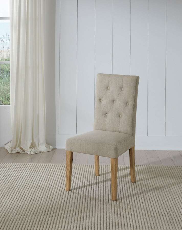 Port Royal Dining Stool featuring beige linen upholstery with button tufting, and natural light wood legs with straight design.