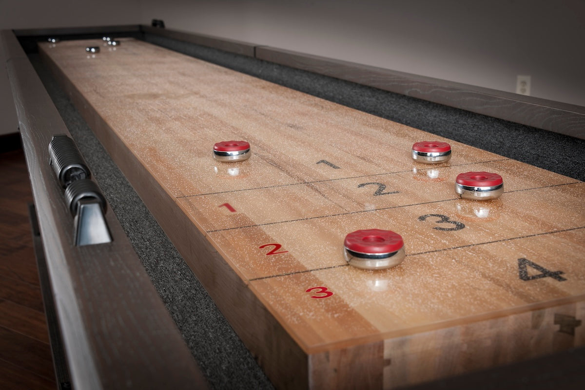 Closeup of the American Heritage Quest shuffleboard table finished in Glacier.