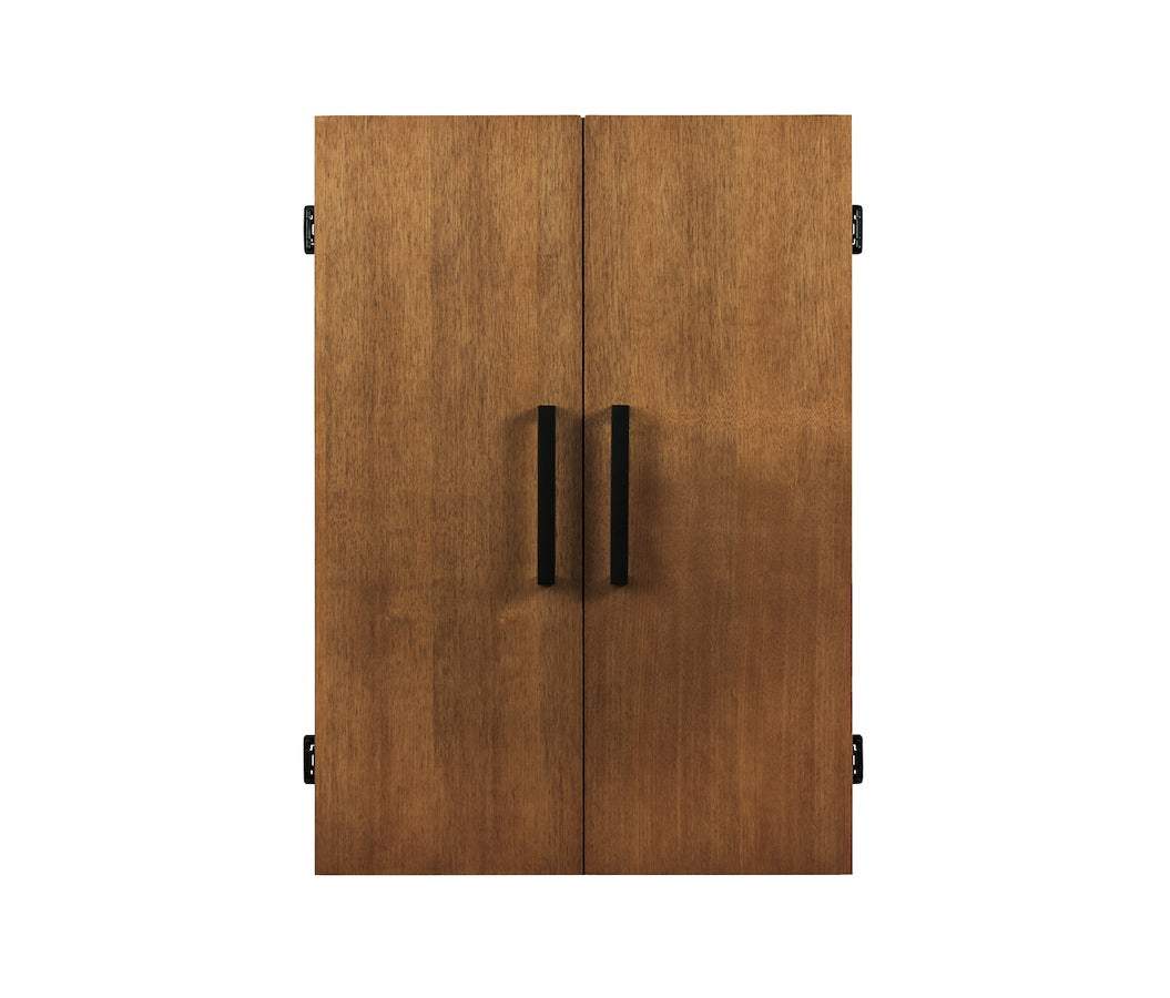 Alta Dartboard Cabinet with brushed walnut finish, handcrafted wood, black handles, and closed double doors showing smooth grain texture.