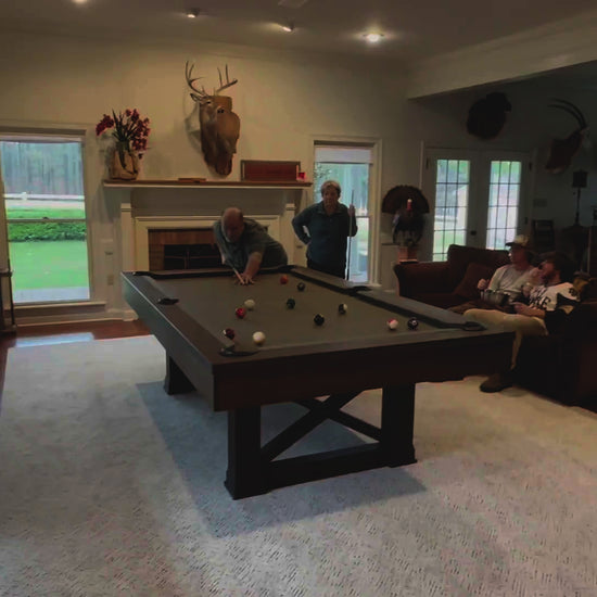 Woman reviews Agriturismo slate pool table in Brownwash purchased from the Family Game Room. 