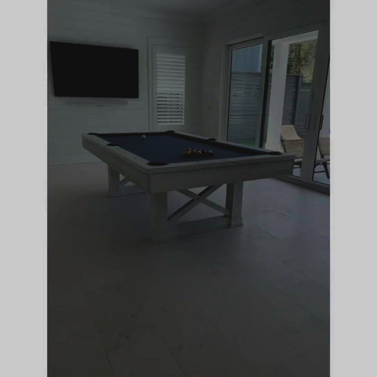 An interior designer reviews an Agriturismo pool table in Whitewash purchased from the Family Game Room.