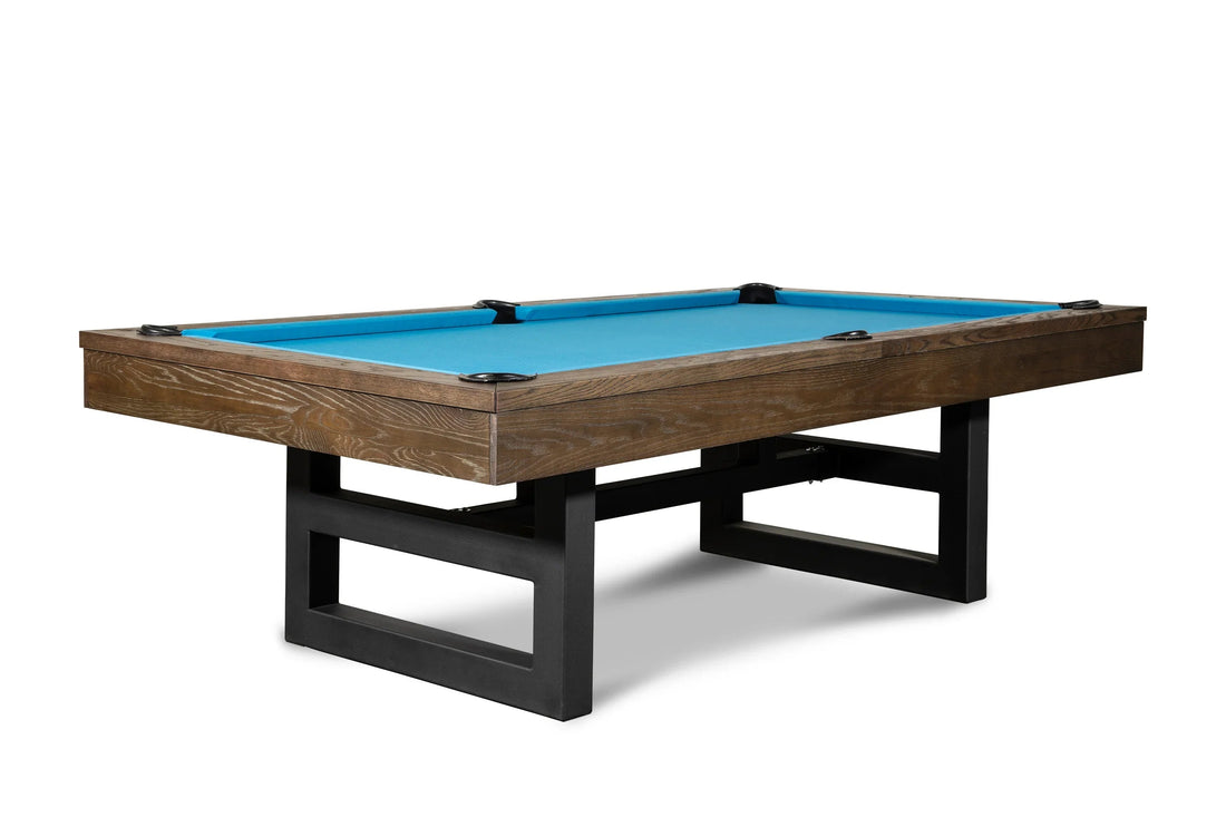 Isabella Chino Slate Pool Table featuring brownwash wood, black metal legs, black leather drop pockets, and bright blue cloth playing surface.