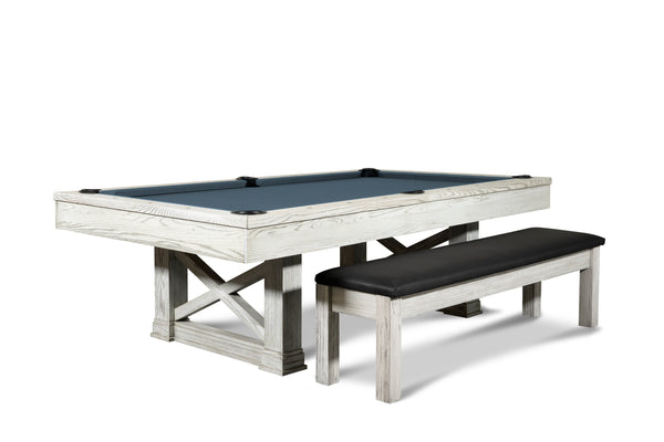 An angled side corner view shot of the Isabella Agriturismo slate pool table with a Isabella storage bench with black leather cushioning.