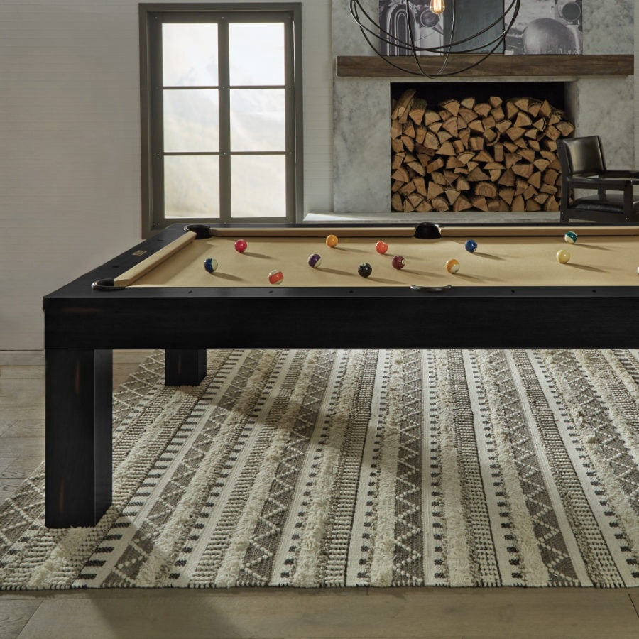 A game room with the Alta slate pool table designed by American Heritage in a Peppercorn finish.