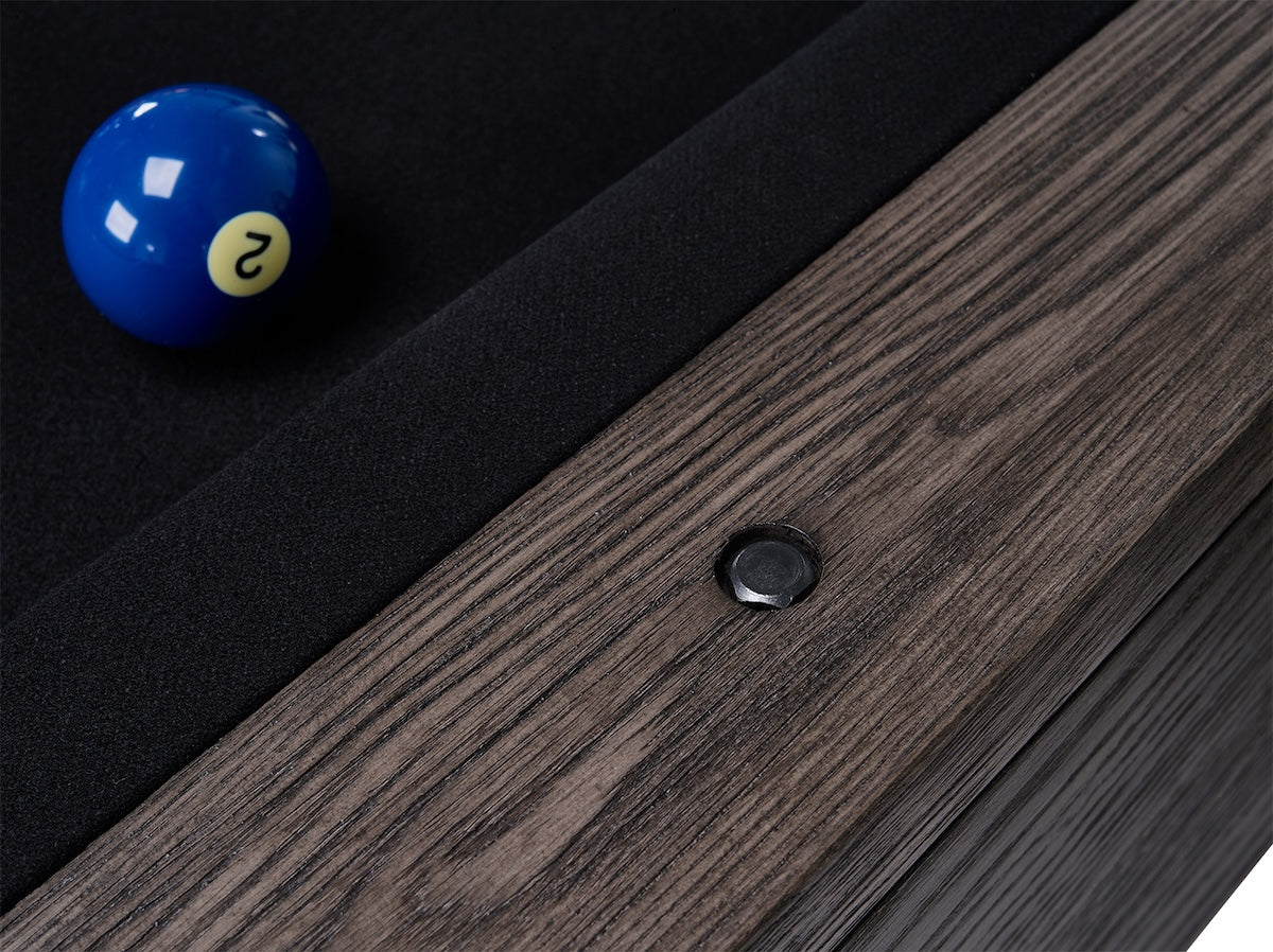 Close-up of a round metal pool table sight of the American Heritage Bristol slate pool table.