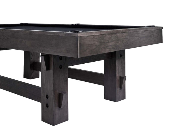 Corner view of the legs of the American Heritage Bristol pool table in Charcoal finish with black felt.