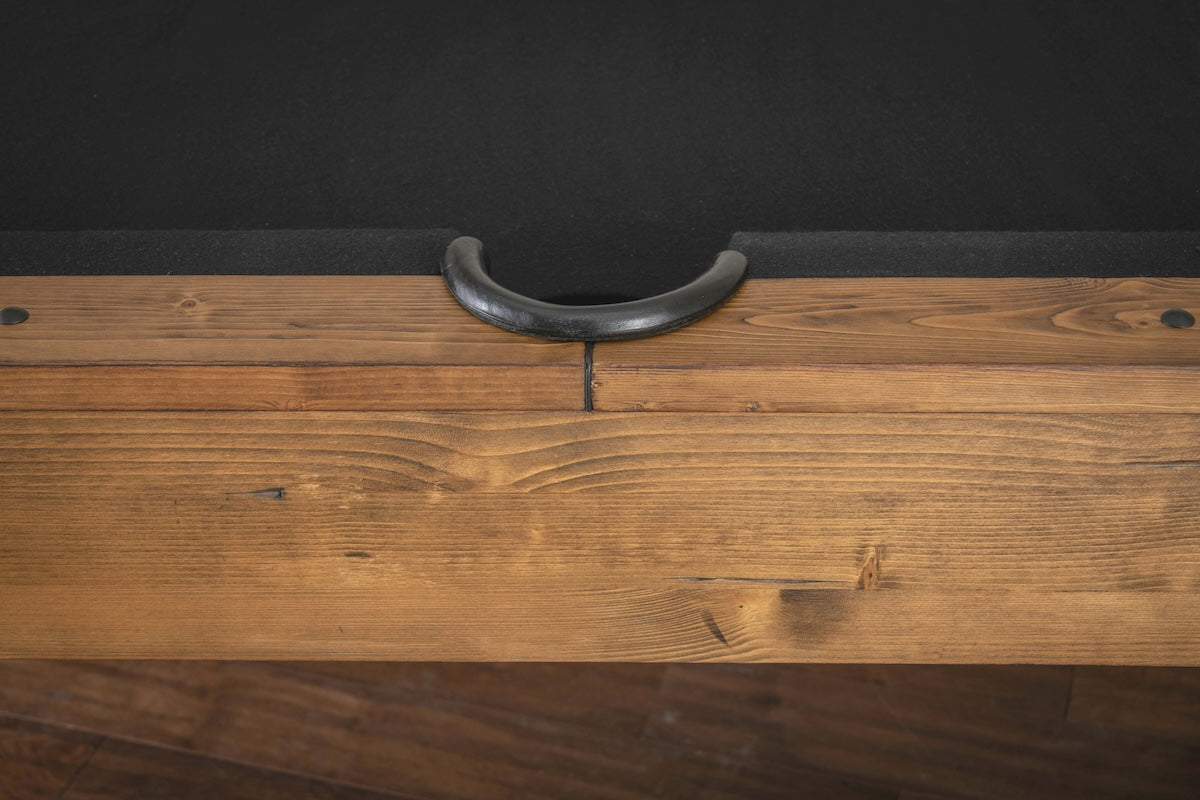 Close-up of a side pocket of the solid-wood Bristol billiard table in a Harvest finish by American Heritage.