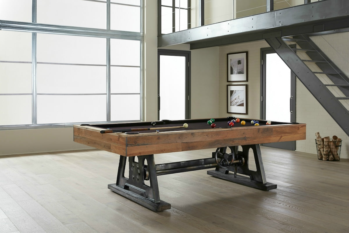 The American Heritage Da Vinci slate pool table with a Reclaimed Brown finish in a game room.