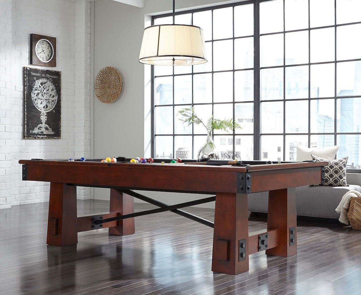 The solid-wood Fresco billiard table designed by American Heritage in a game room.