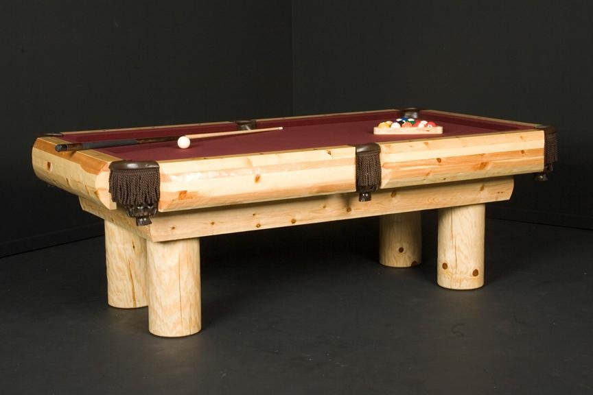 Viking Industries rustic billiard table in natural ponderosa pine with round log legs and burgundy cloth, includes pool cue and balls.